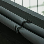 Grey oxford fabric cover with fastening straps for the elevated dog house.