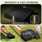 Black foldable sandbox cover with orange reflective strip and storage bag