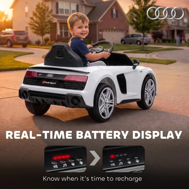 White kids electric ride-on car from rear with child onboard and red tail lights
