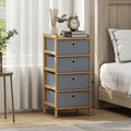 Narrow chest of drawers with bamboo frame and four light grey fabric drawers, side view
