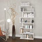 White 6-tier bookshelf with open shelves holding books and small decor items
