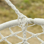 Close-up of cream macrame hammock chair rope knot and woven net seat