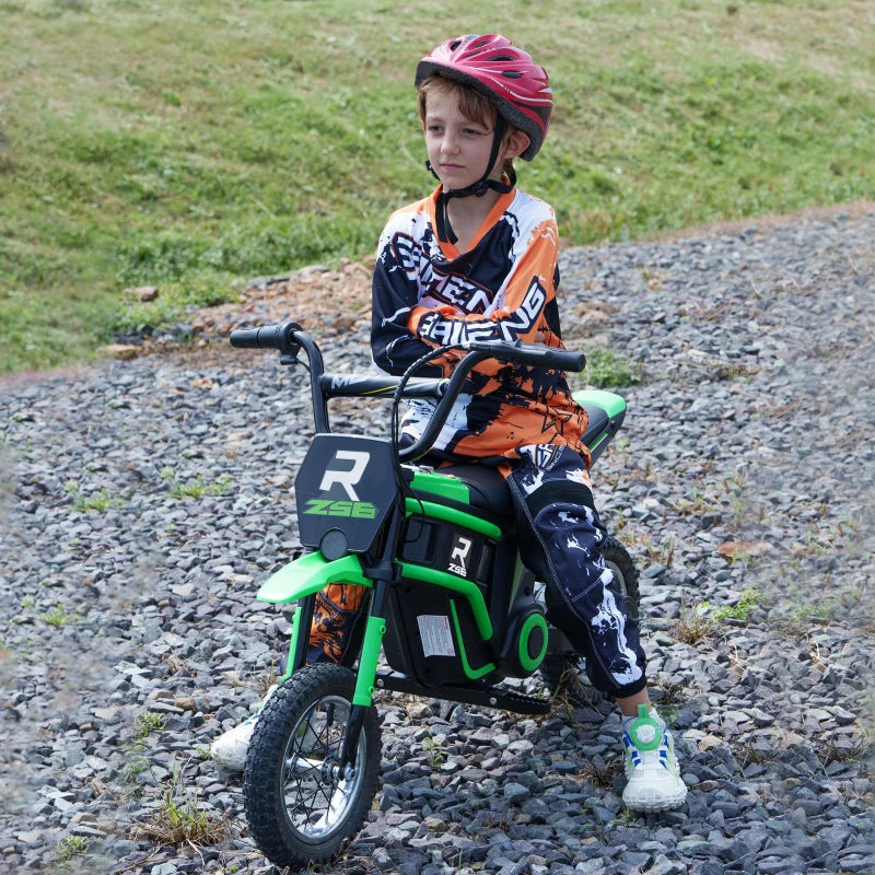 Child wearing helmet riding a green electric dirt bike on a gravel path