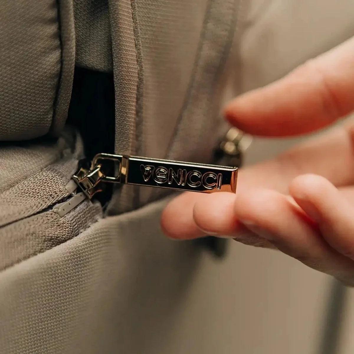 Venicci logo metal buckle on stroller fabric strap