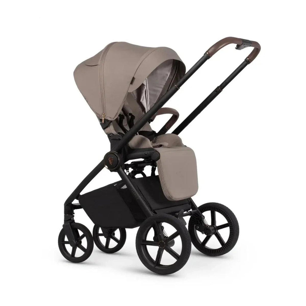 Almond stroller carrycot with canopy and black chassis, angled side view