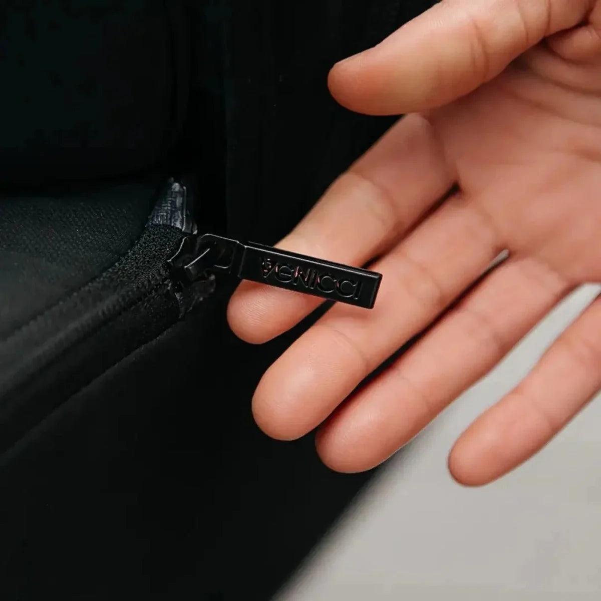 Black stroller strap with Venicci branded label and buckle