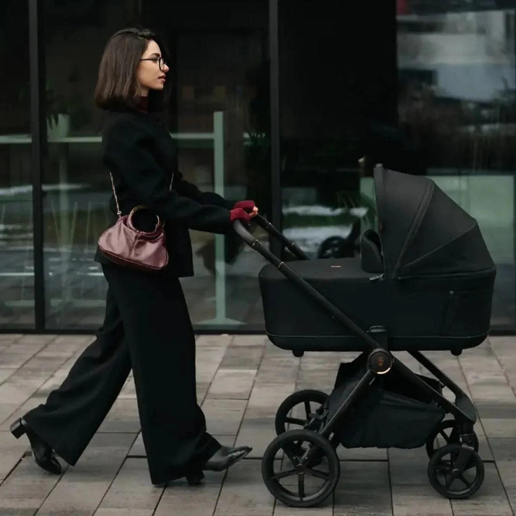 Dark stroller with seat and large wheels