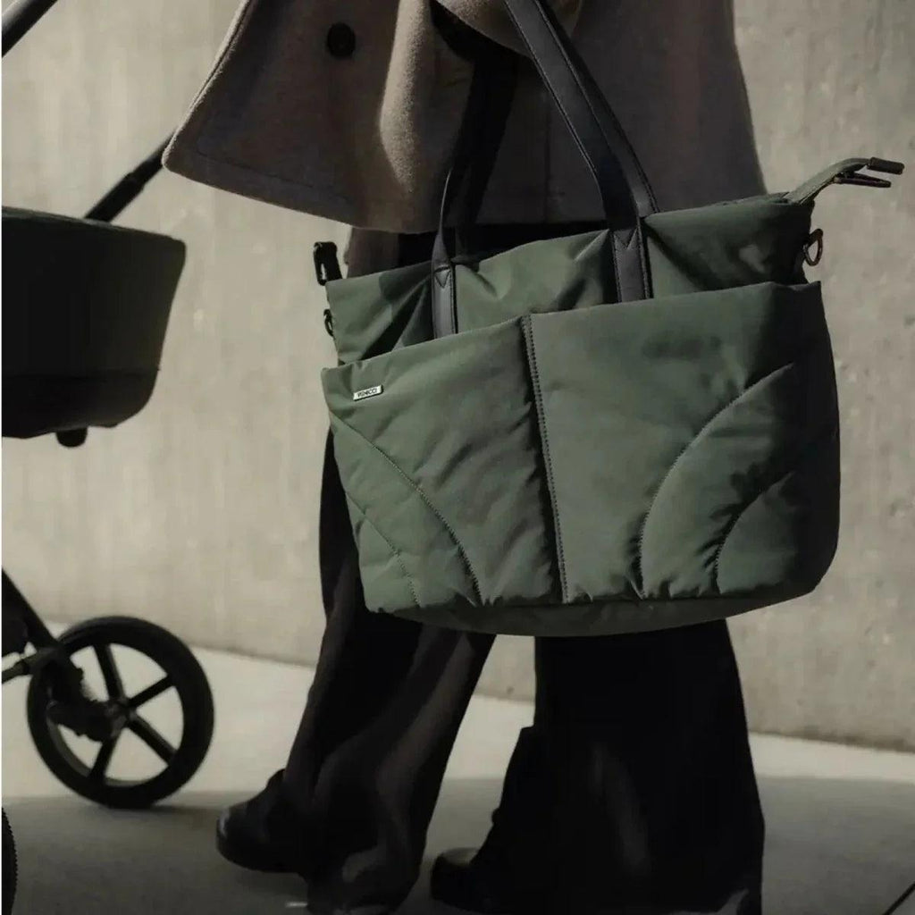 Forest changing bag accessory pouch attached to stroller handle area with zip pockets.