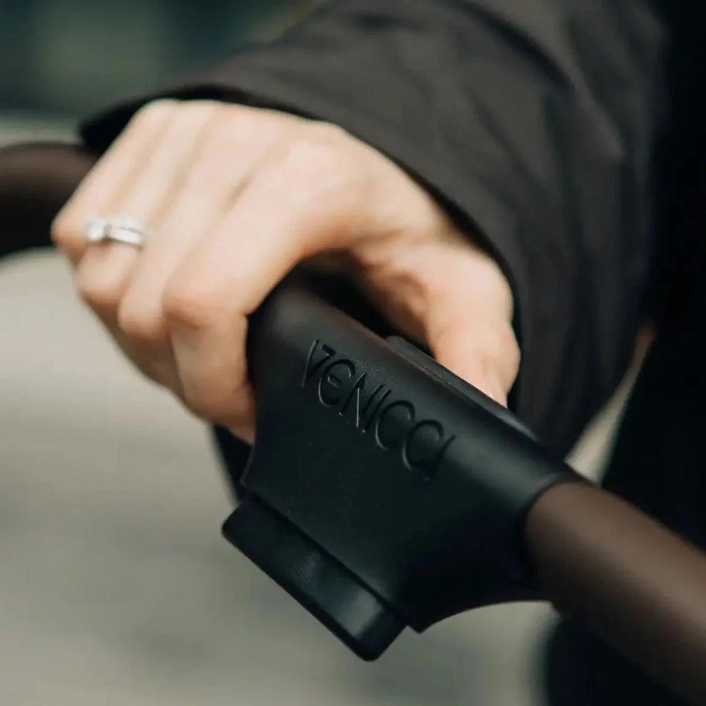 Stroller handle grip with molded Venicci branding