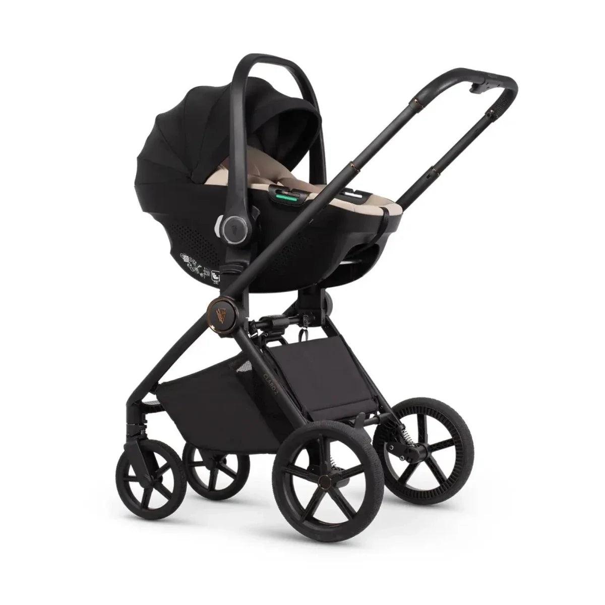 Black stroller set with carrycot and seat unit, beige interior and black wheels
