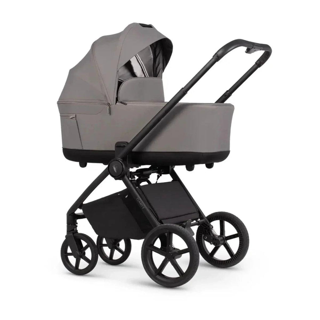Beige/fog stroller with carrycot and hood, black frame, and four wheels