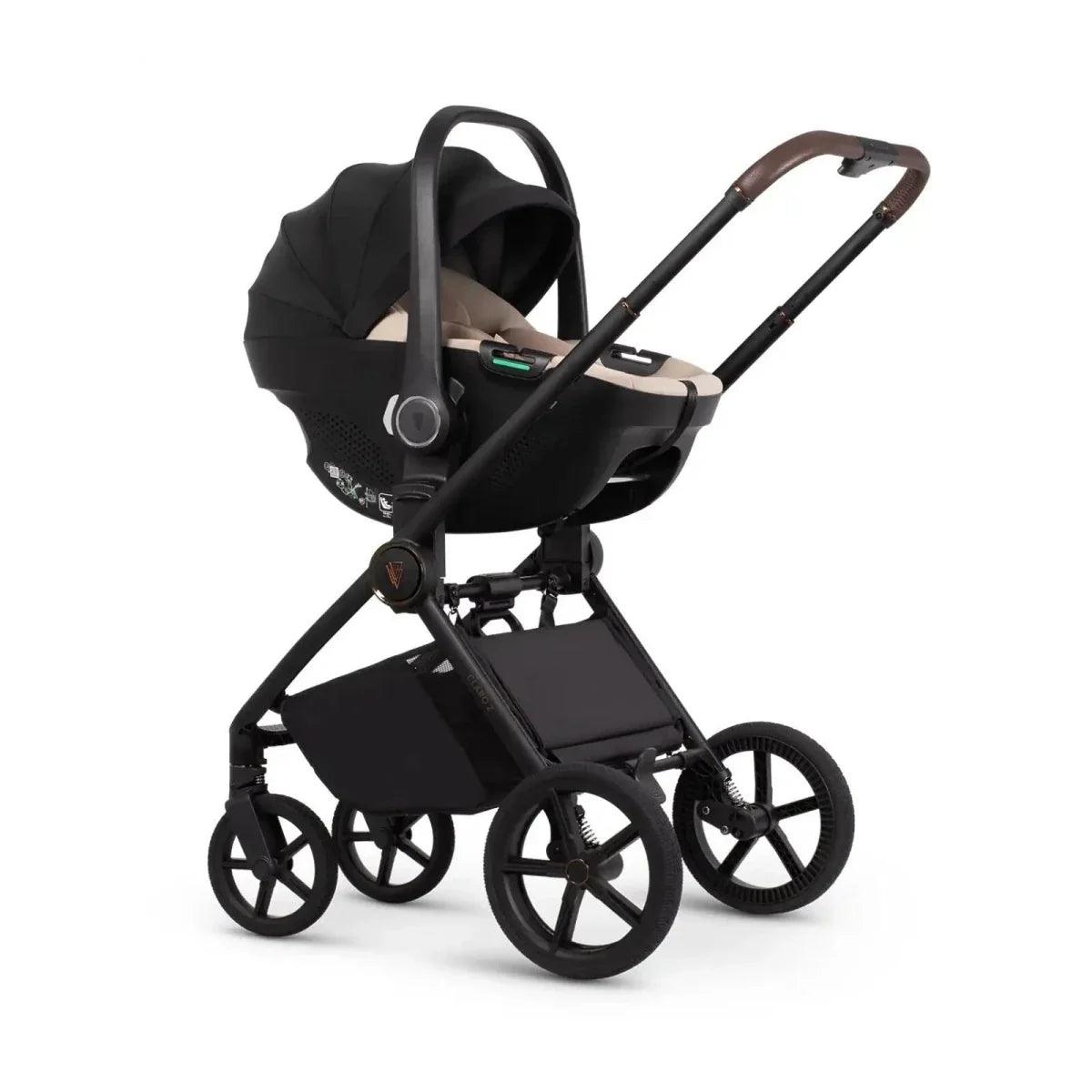 Black stroller with beige infant car seat insert and canopy