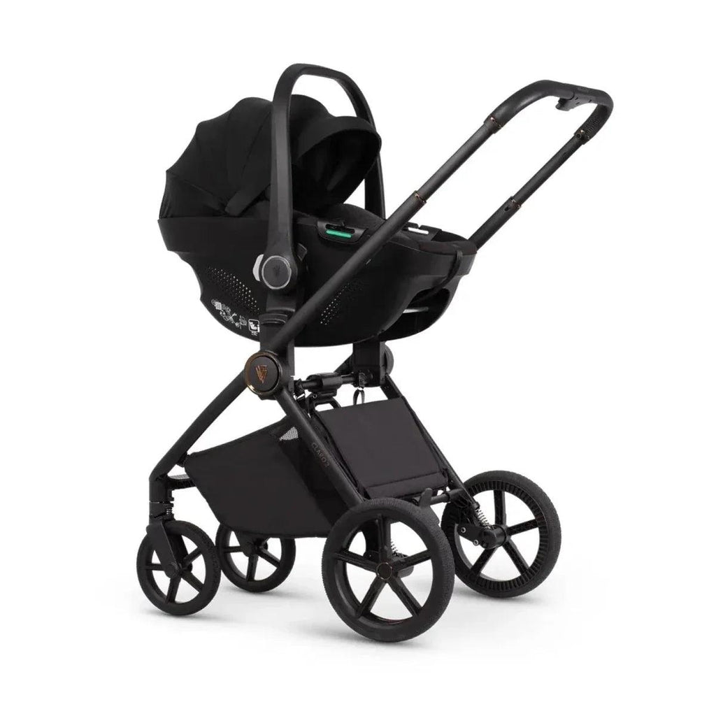 Stroller with carrycot and seat attachments, black fabric, black wheels and frame