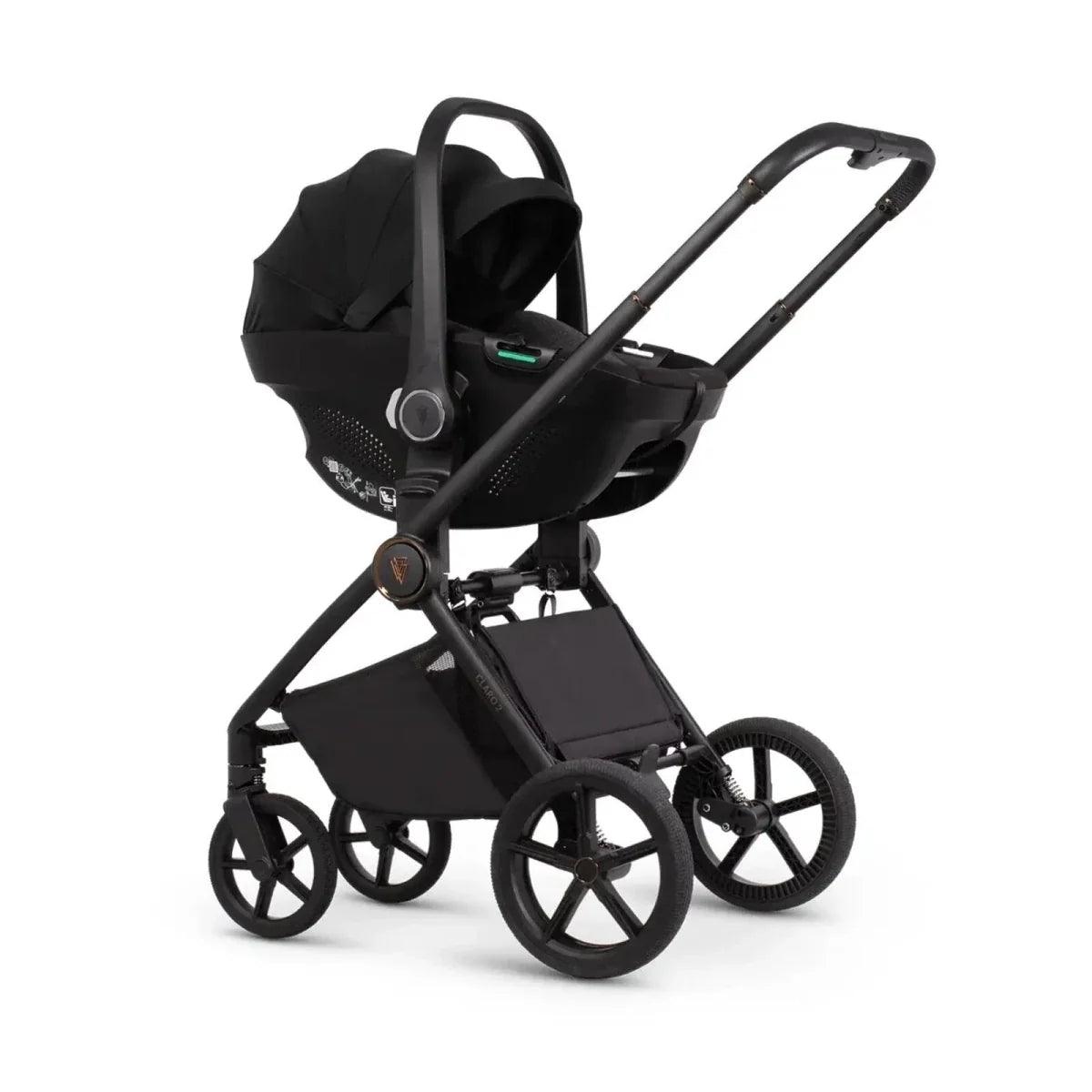 Black stroller with carrycot and seat platform, front three-quarter view
