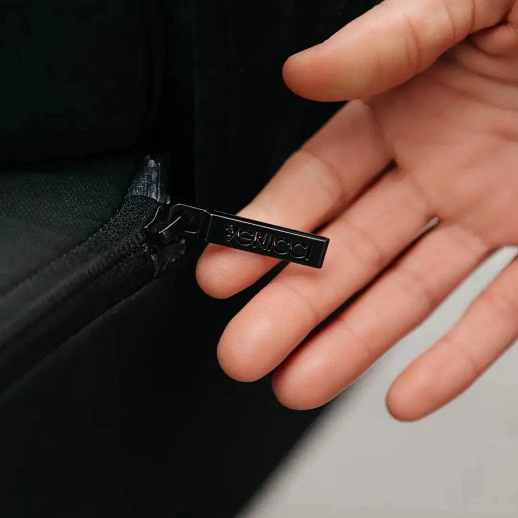 Black fabric strap with Venicci logo tag on stroller accessory