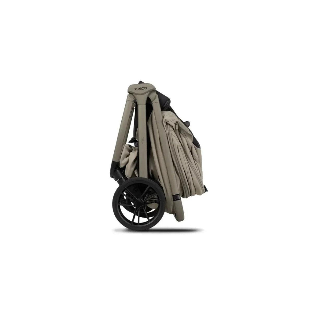 Beige 2-in-1 stroller with carrycot and seat, folded side profile, black wheels