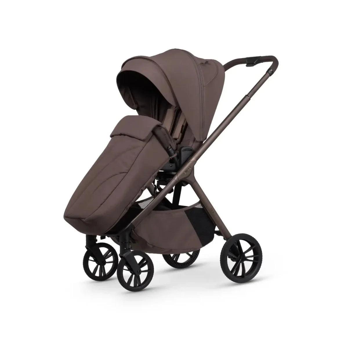 Brown stroller with carrycot and seat unit, tilted handle and front wheel close
