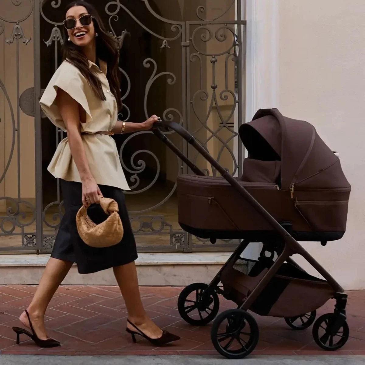 Brown 2-in-1 stroller with canopy and carrycot, black frame