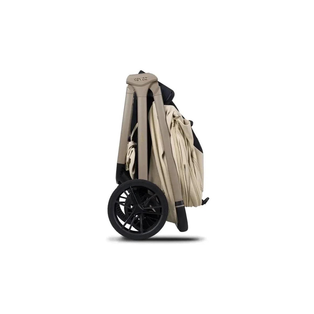 Light beige stroller with folded canopy and wheels, angled side view