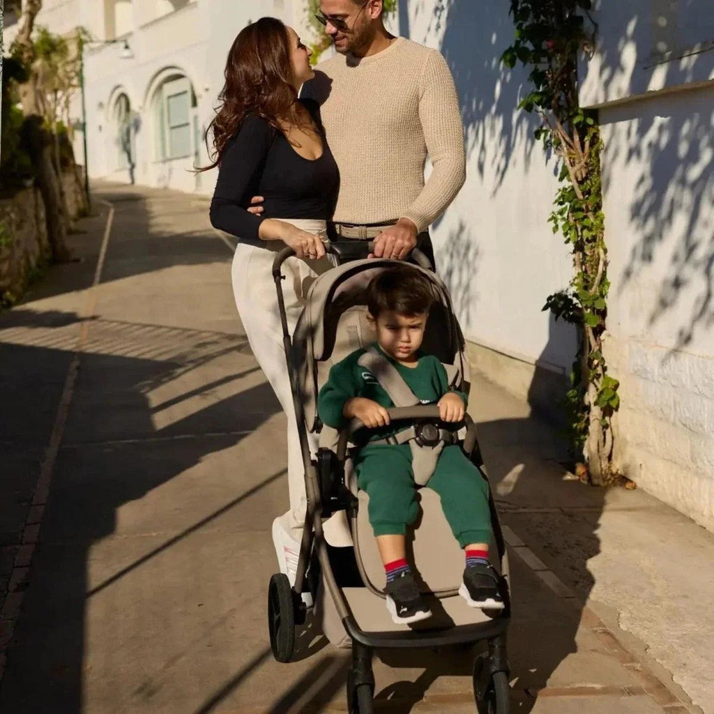 3-in-1 stroller in black with light-colored handlebar and wheels