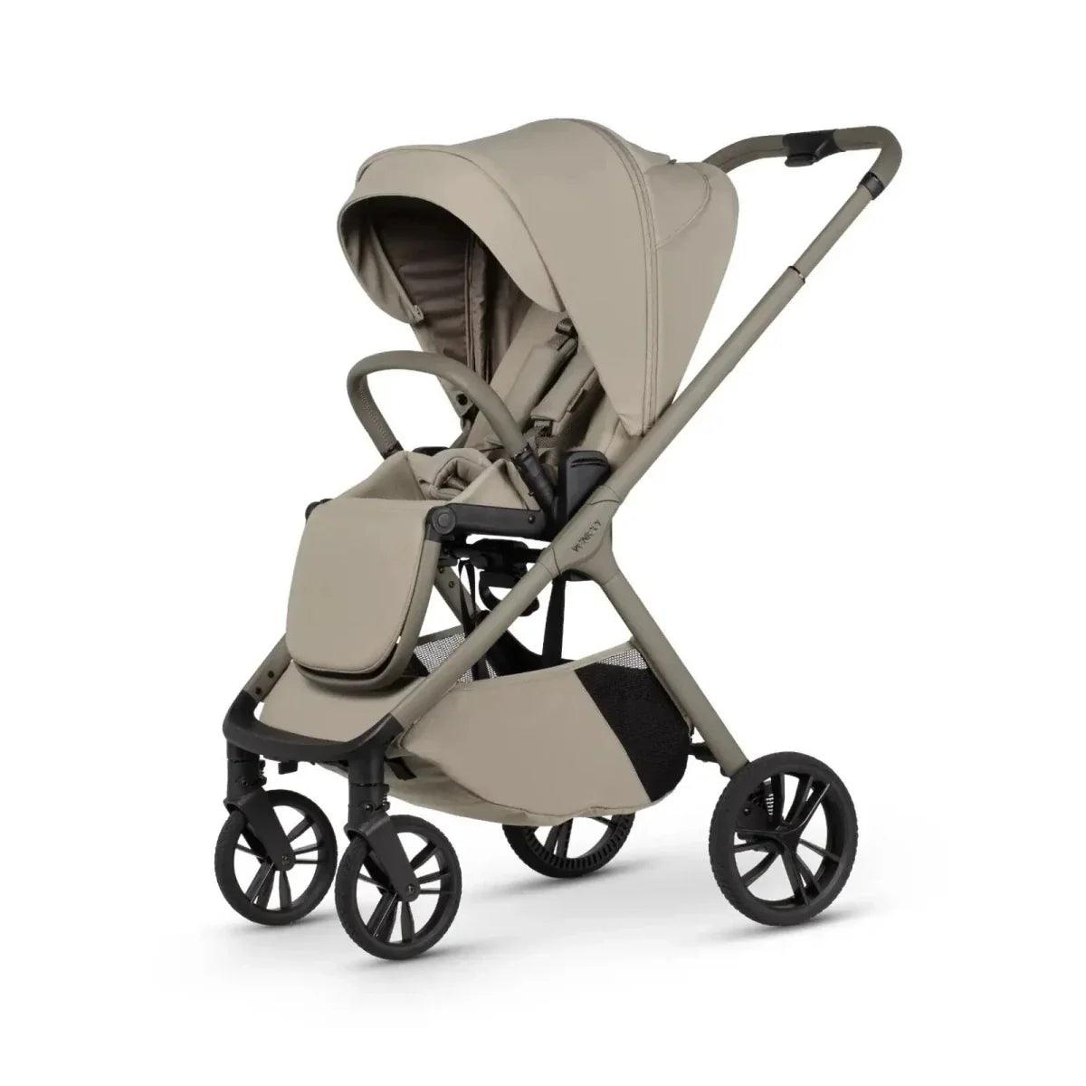 Latte stroller with padded seat and footrest, black wheels, side view