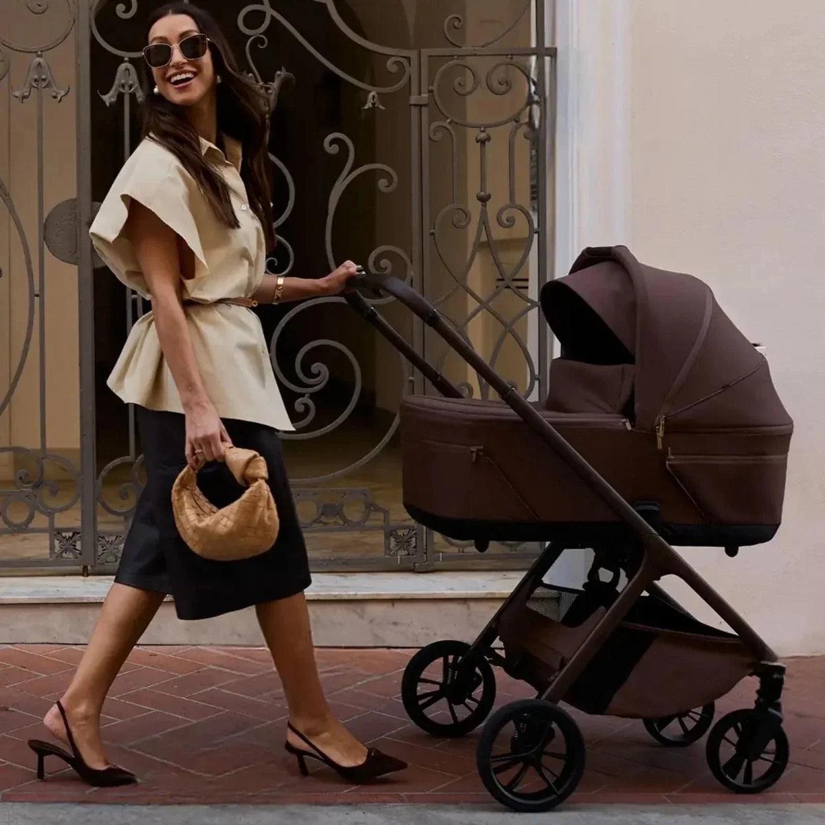 Side-view stroller with canopy and carrycot, dark frame with brown seat