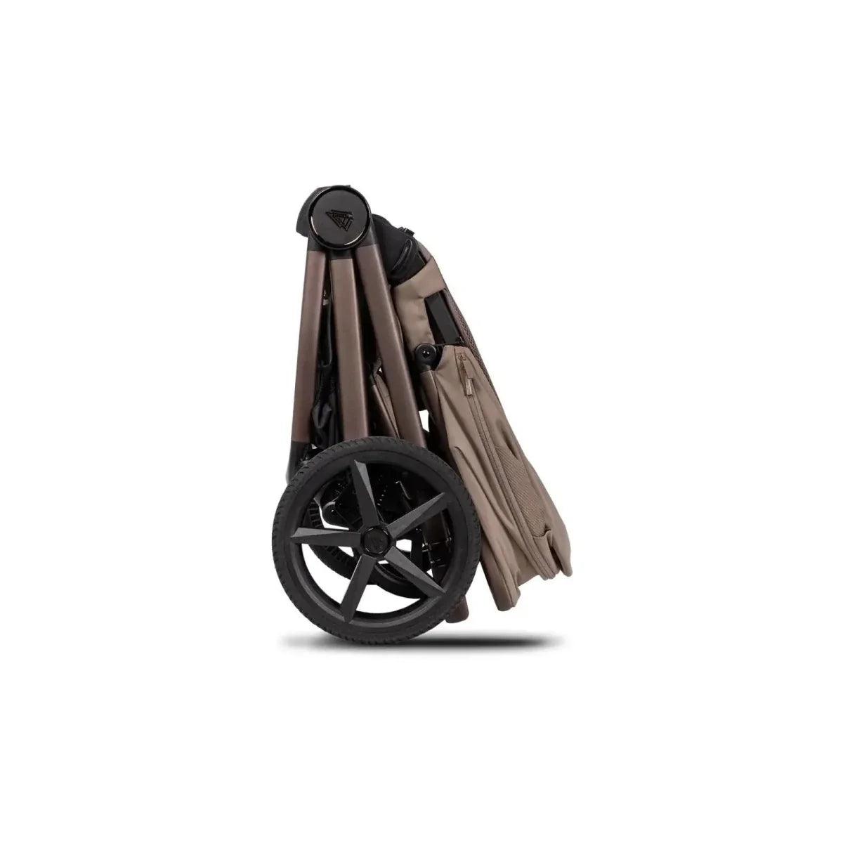 Sand stroller with canopy and black wheels, side view