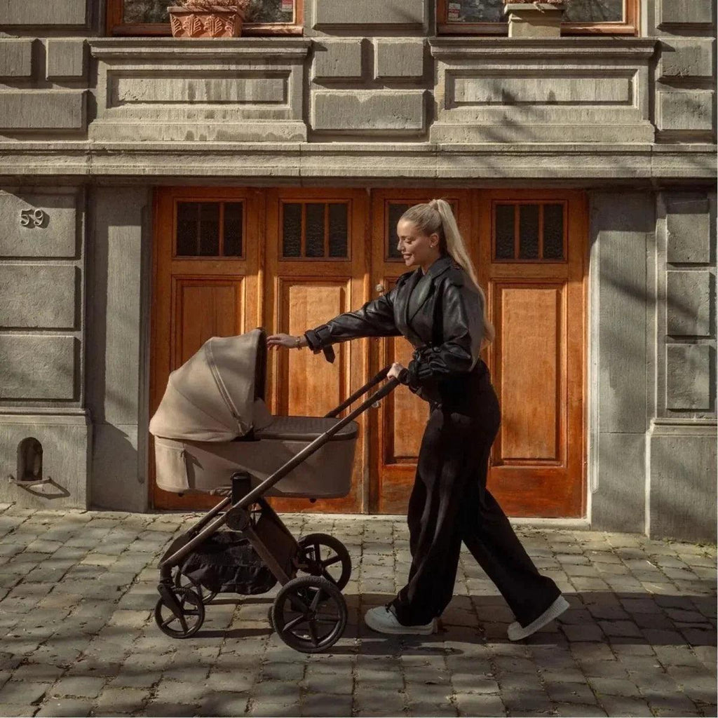 Sand-colored 2-in-1 stroller with large wheels and standing handle