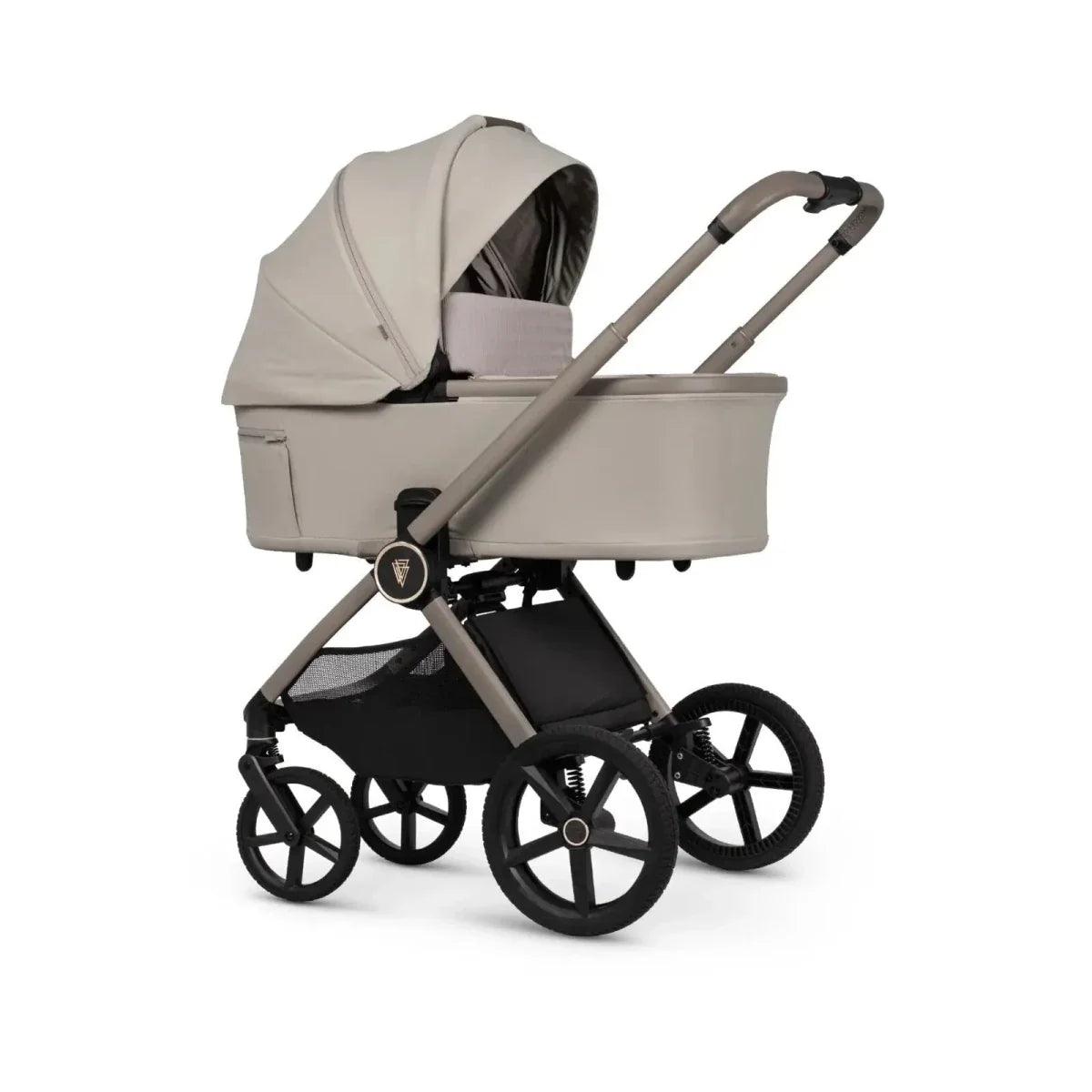 Pebble baby stroller with light canopy, black frame, and front swivel wheels, side view