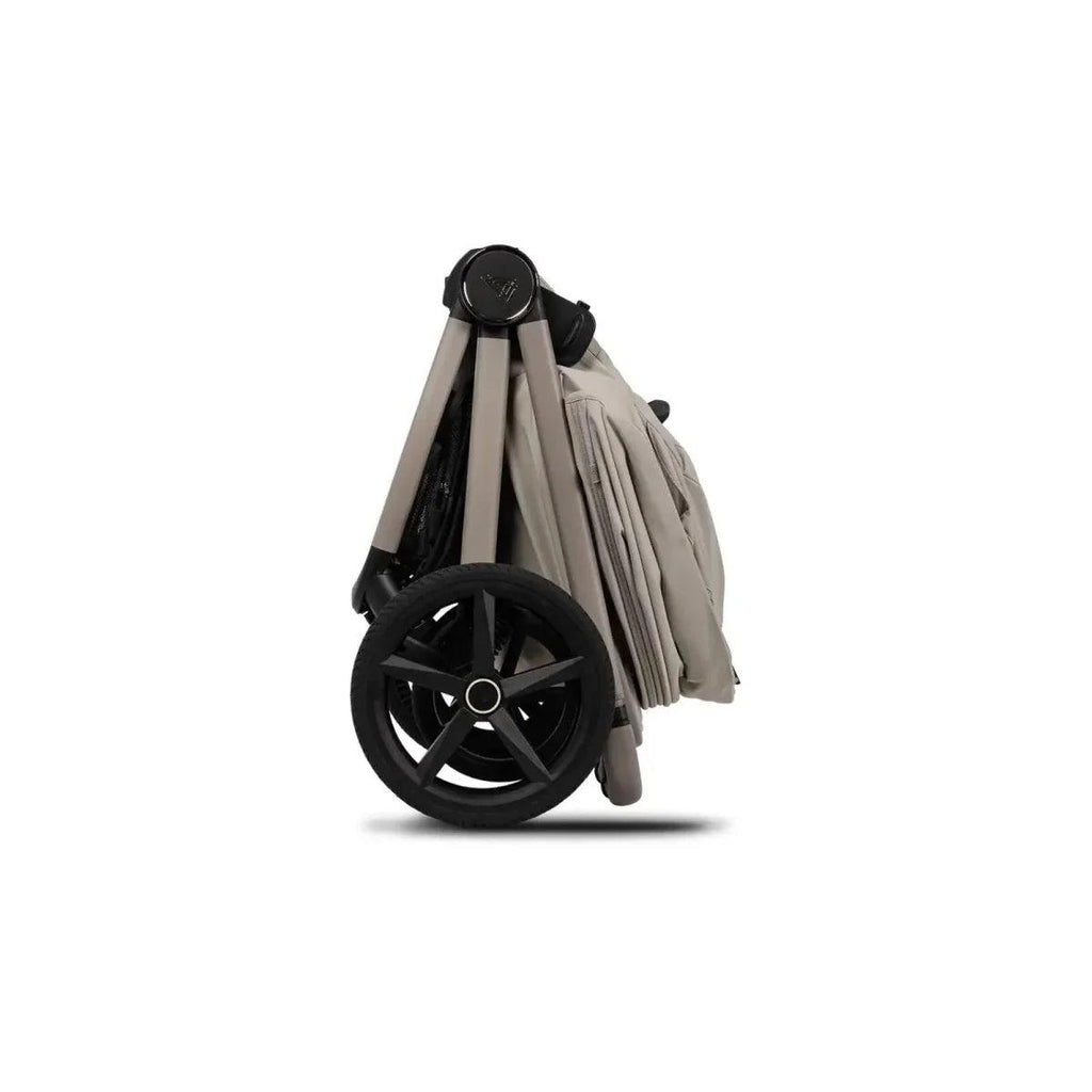 Pebble stroller with extended carrycot canopy and black wheels, rear three-quarter view