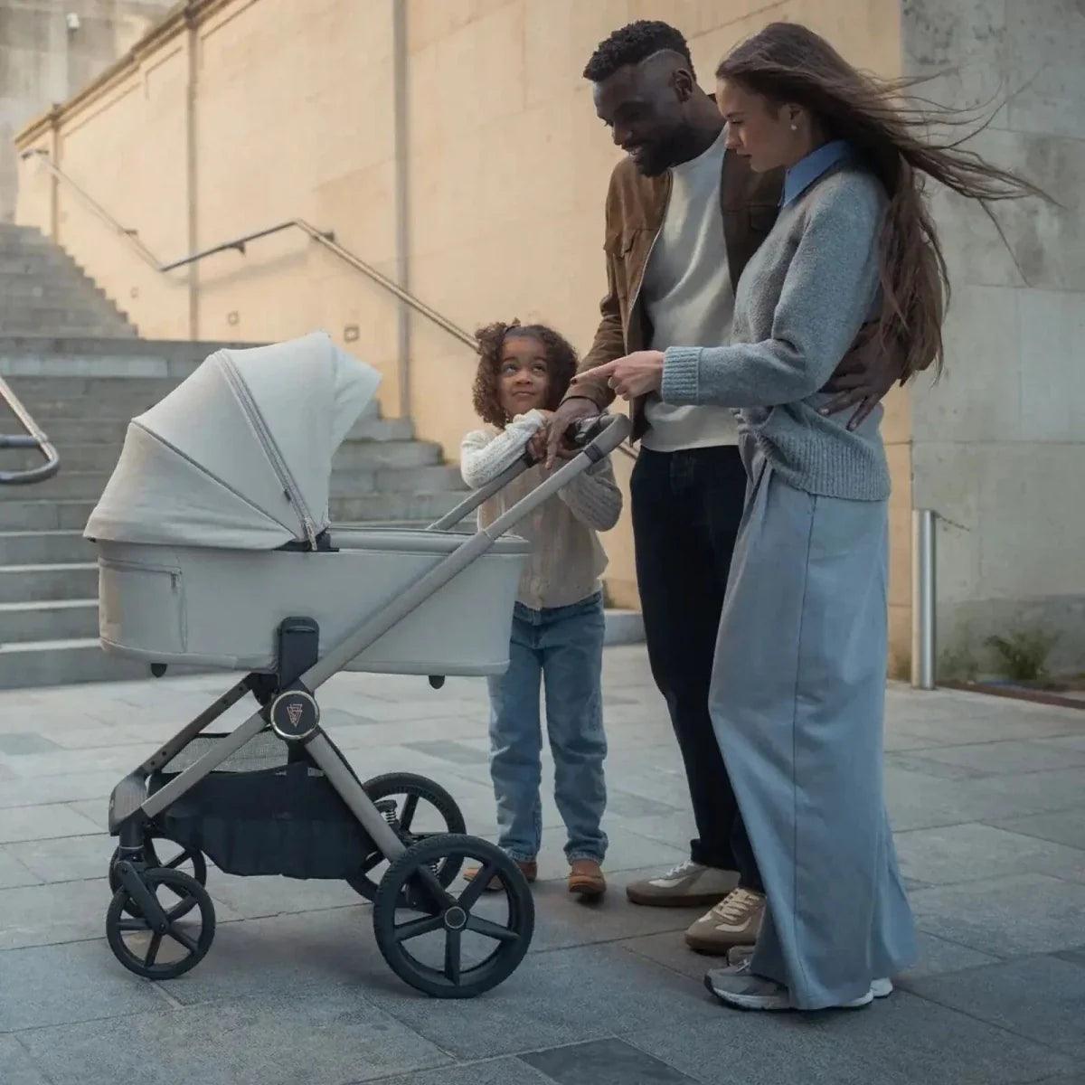 Pebble stroller with canopy and large wheels, outdoors