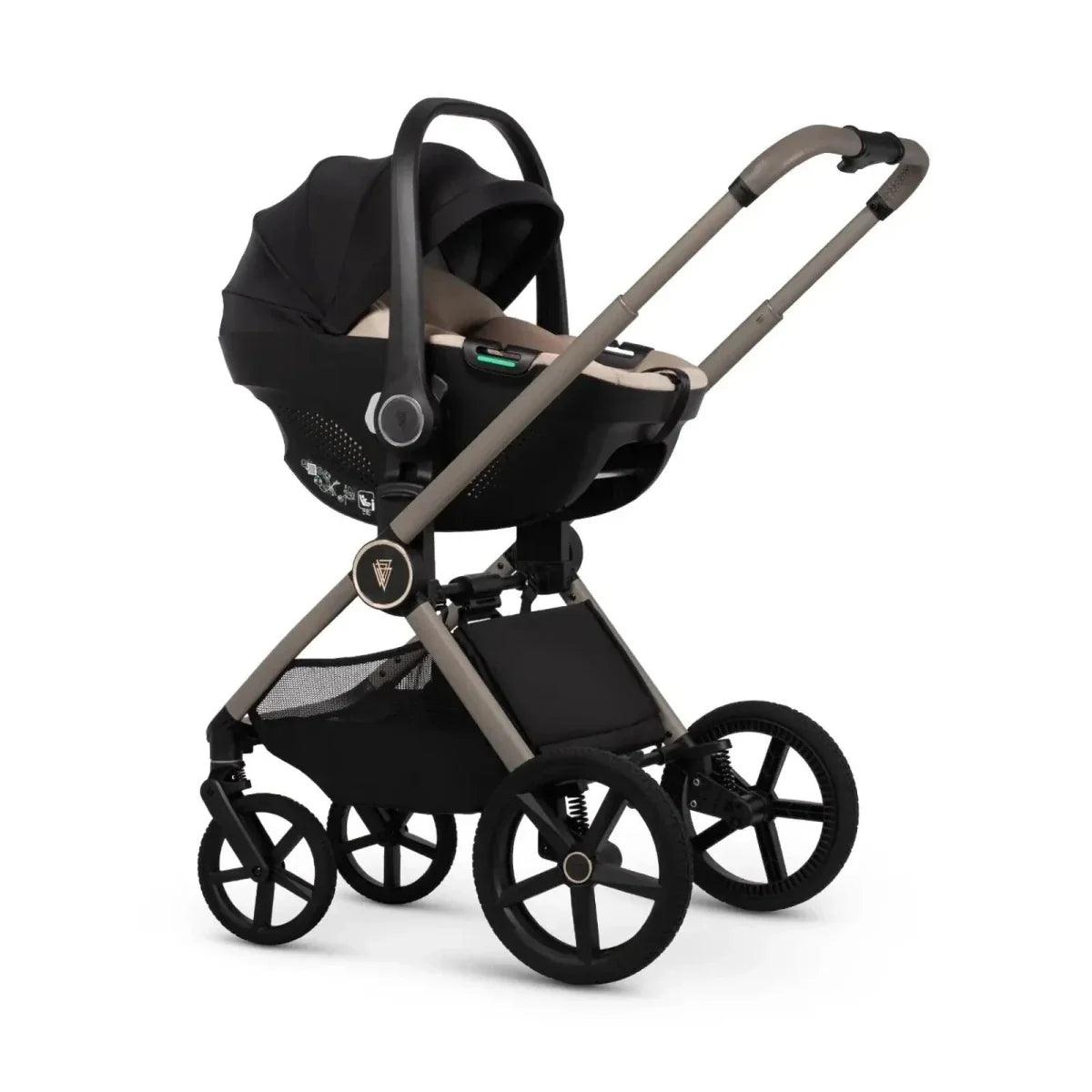Black infant car seat with beige insert on stroller frame