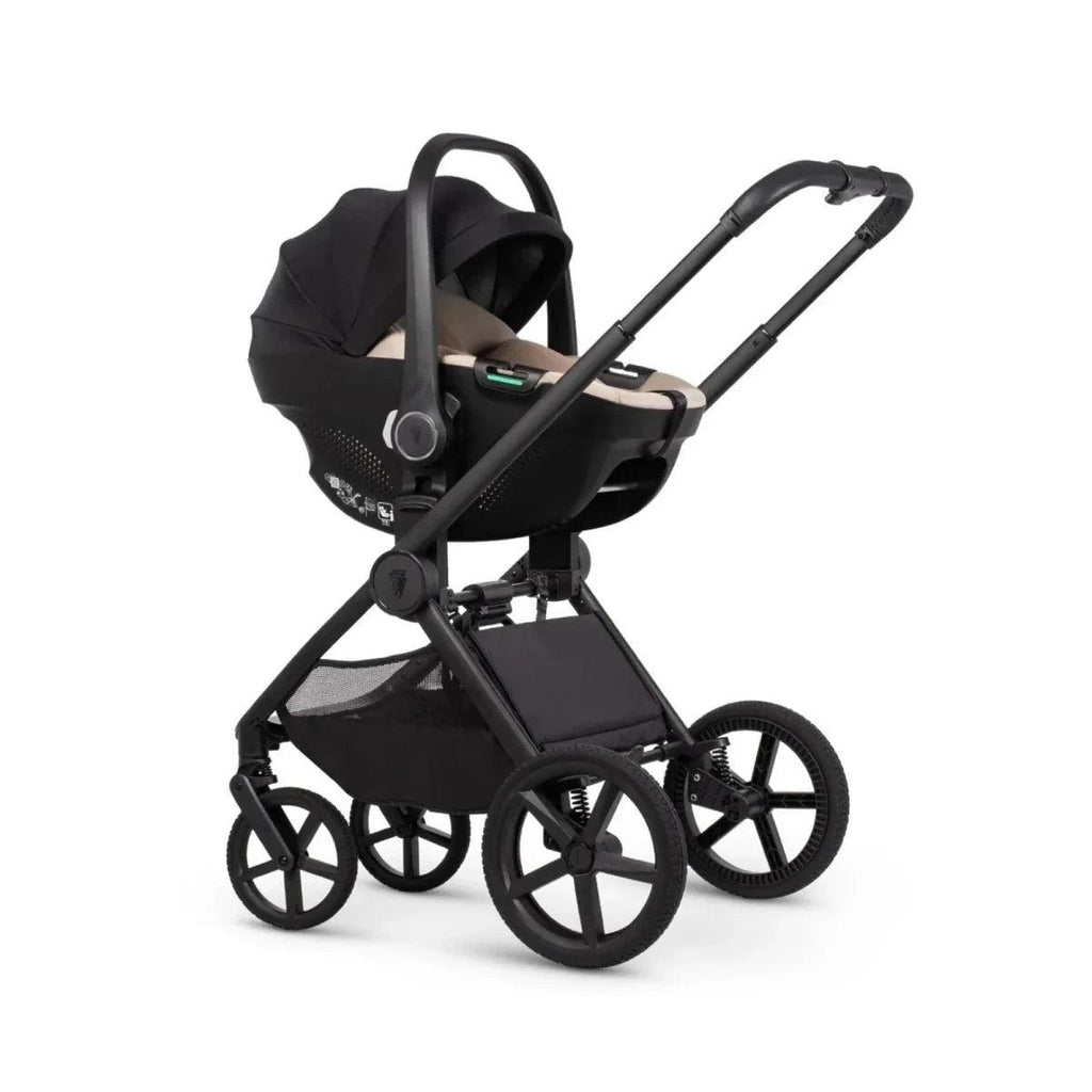 Black stroller with carrycot attachment, canopy, and large wheels