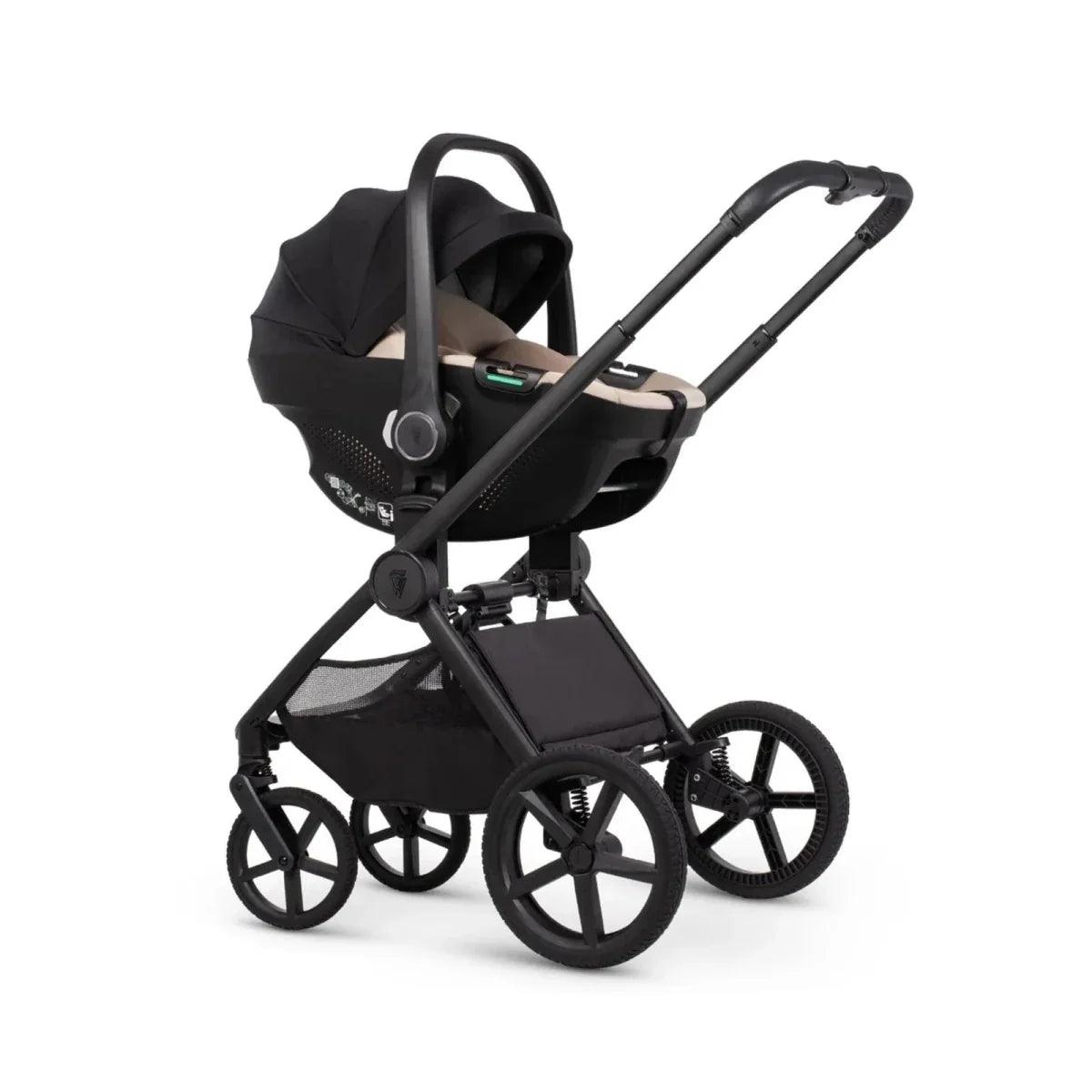 Black stroller with carrycot attachment, canopy, and large wheels