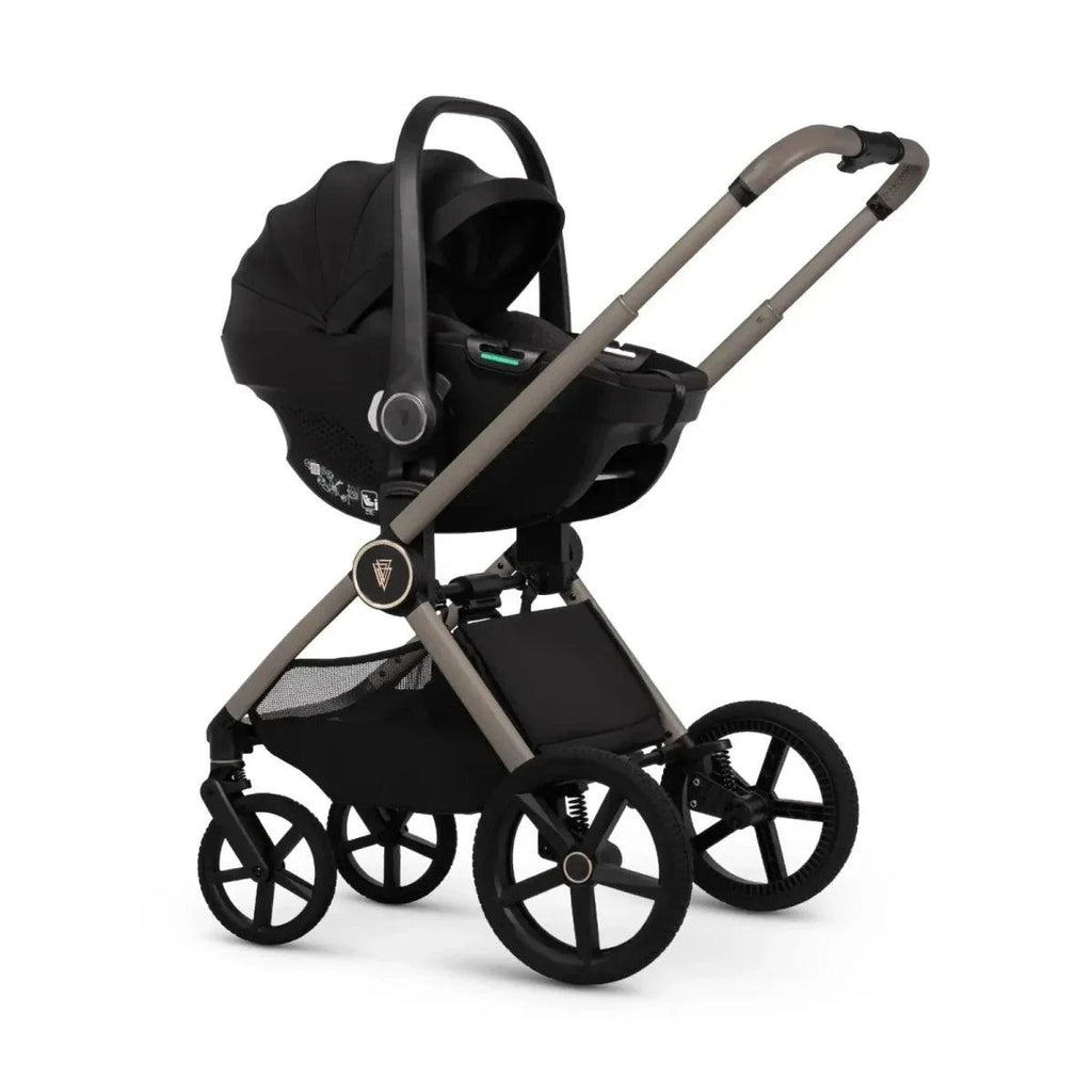 Stroller with black seat unit and hood, beige frame, and black wheels