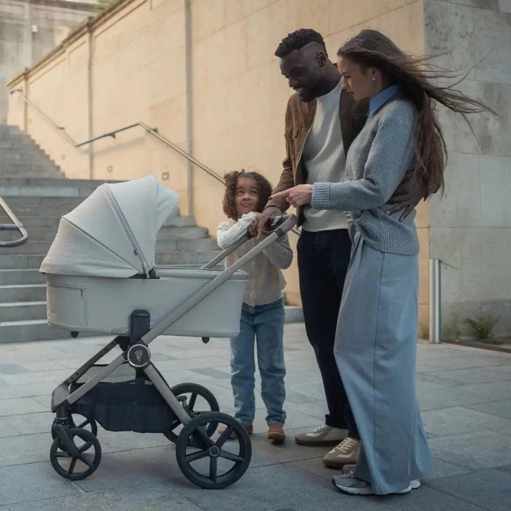 Light blue stroller bassinet with canopy and five-point wheels