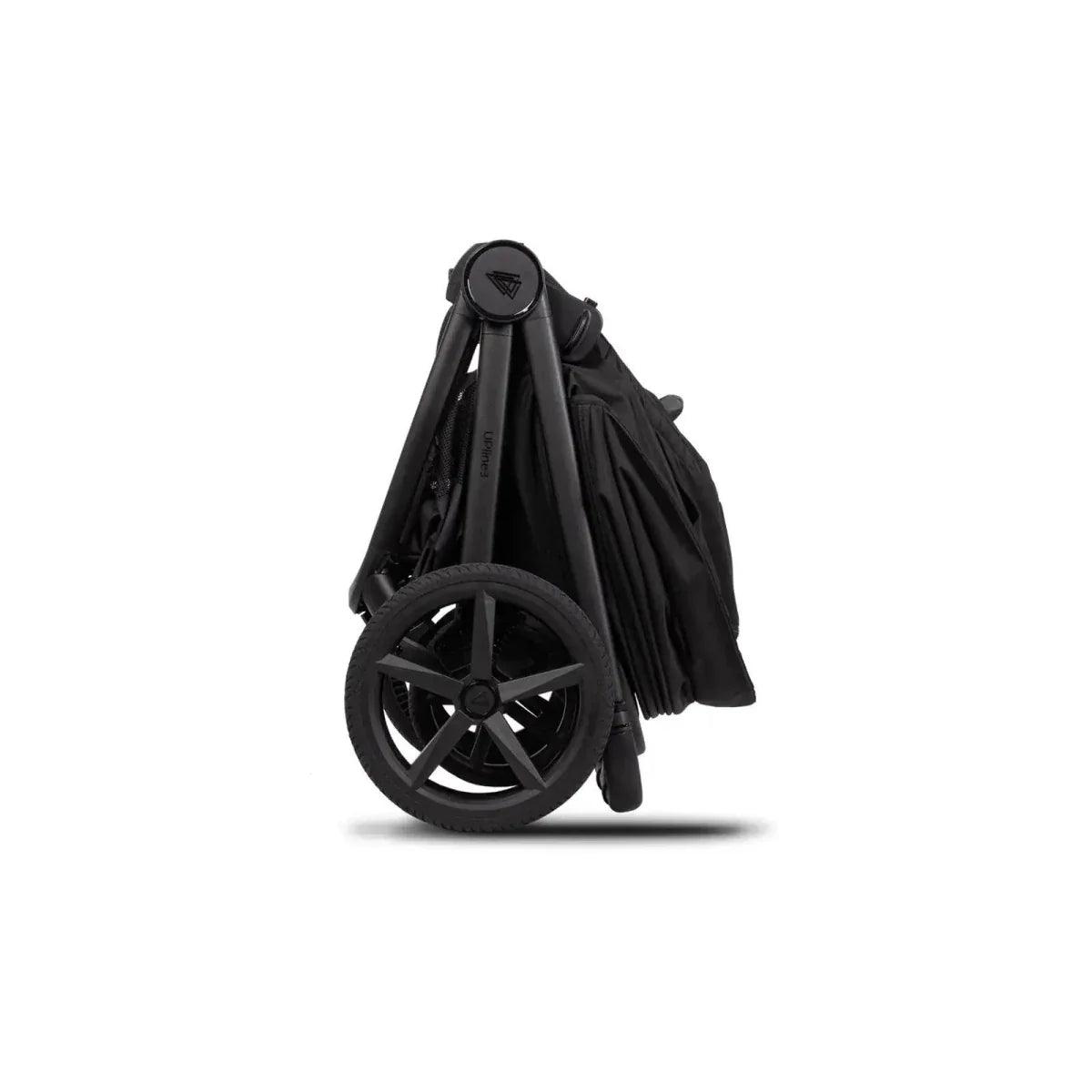 Black stroller in folded position with wheel set and attached fabric canopy