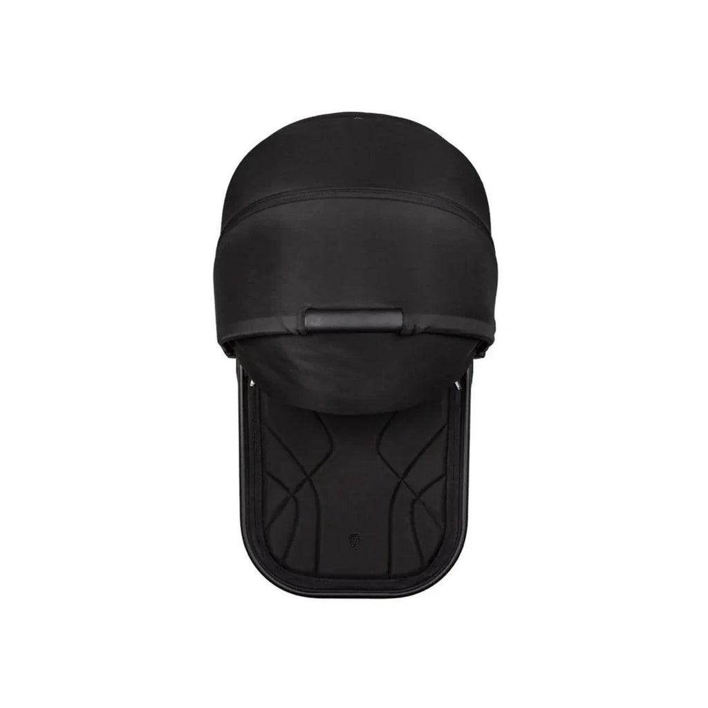 Black infant car seat with integrated hood and padded shell insert