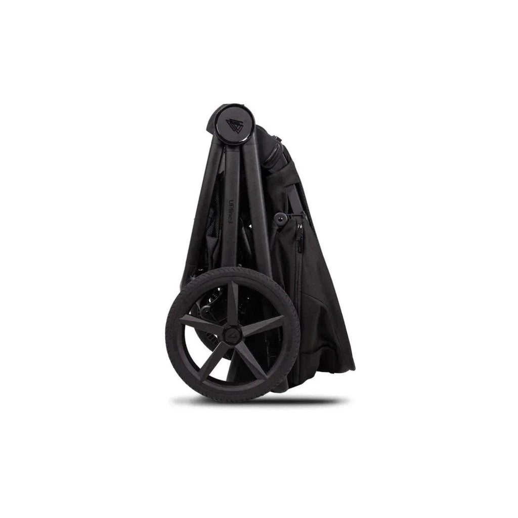 Black stroller frame with large front wheels and folded fabric basket base