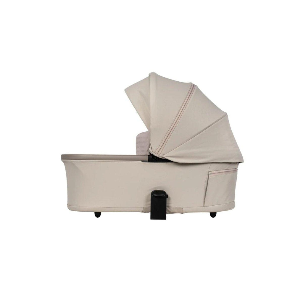 Beige stroller carrycot with raised hood and padded interior
