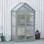 Grey polycarbonate greenhouse cold frame with closed double doors and peaked top