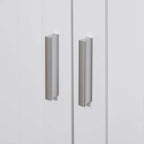 White cabinet-style door handles on wooden cat litter box enclosure