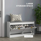 White shoe storage bench with gray cushion and flip drawers holding shoes