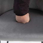 Grey upholstered dining chair seat with visible stitching and fabric texture