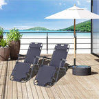 Pair of grey folding sun lounger recliner chairs with armrests and adjustable backs