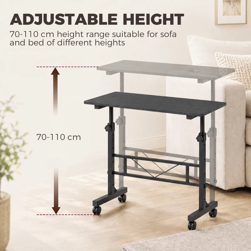 Adjustable black overbed table with legs and rolling casters, height range indicated