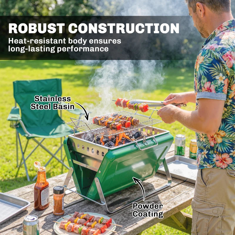 Green charcoal BBQ grill with stainless basin and wire grate, smoke rising
