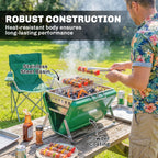 Green charcoal BBQ grill with stainless basin and wire grate, smoke rising