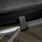 Black cushion tie band fastened around lounge chair frame bar