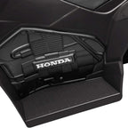 Black electric quad bike battery compartment with Honda logo, close-up